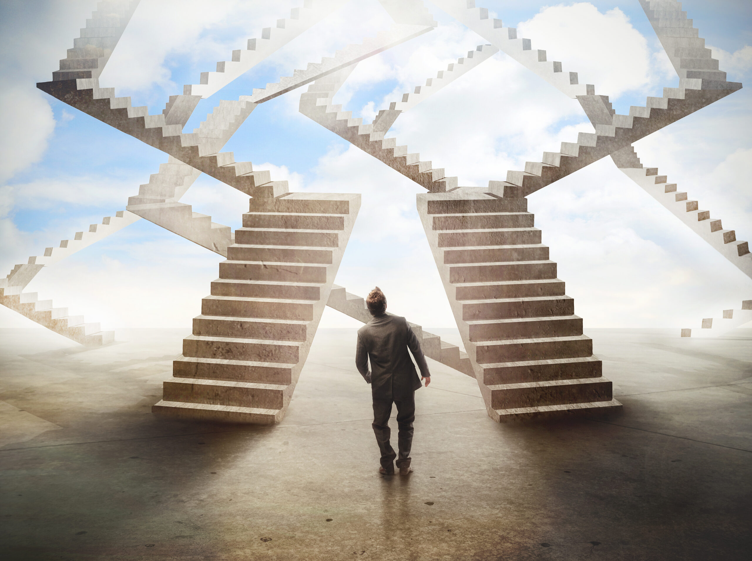 labyrinthic staircases with confused business man at bottom