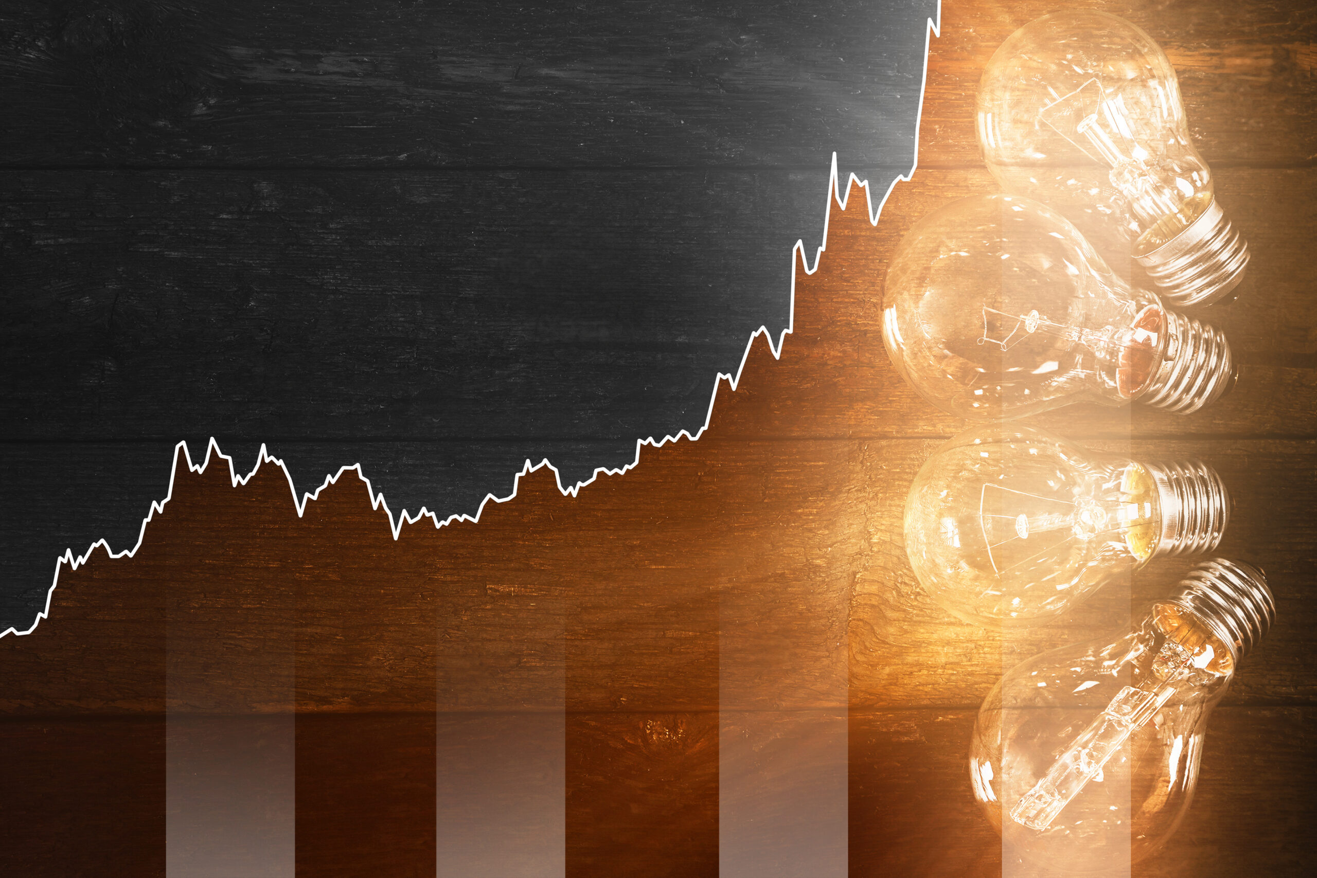 light bulb and chart depicting rising business energy costs